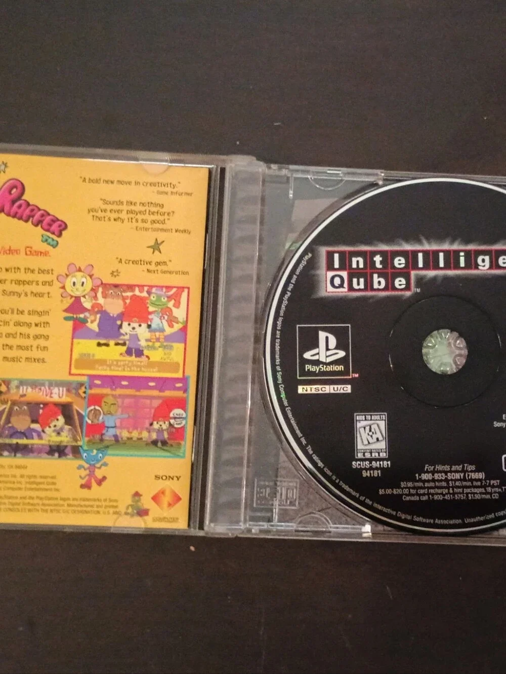 Sony Ps1 Intelligent Qube Cib— Black & Green Cover Art
